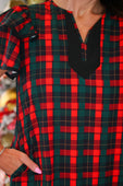 Ava dress red plaid with black trim featuring a split neckline perfect for casual and festive occasions
