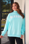 Light blue oversized blessed mock neck pullover sweatshirt with white printed lettering and comfortable fits size