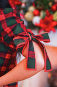 Evelyn dress red plaid fabric with a tie sleeve bow detail at the cuff in festive red and green plaid pattern