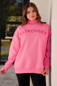 A vibrant pink extrovert mock neck pullover with oversized fit size and bold extrovert print on the chest