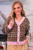 Brown gingerbread knit cardigan with pink and white striped trim and cream heart and snowflake patterns