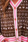 Brown knit cardigan with white and pink trim featuring heart and snowflake pattern gingerbread knit cardigan