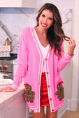 Pink ginny the gingerbread girl long cardigan with white trim red buttons and brown gingerbread appliqués on front