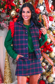 Navy christmas plaid puffer vest with red green and navy pattern paired with matching skirt and ruffle shoulder details