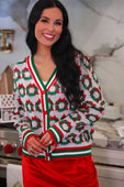 Festive white red and green ribbon wreath knit cardigan with holiday wreath pattern and striped trim