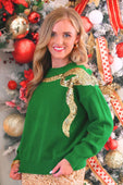 Green sequin bow knit sweater featuring a gold sequined bow detail across the shoulder
