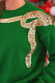 Green sequin bow knit sweater with shimmering gold sequin snake design wrapping the shoulder and front