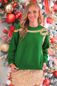 Green sequin bow knit sweater with gold sequin detailing on shoulders and neckline in soft knit fabric