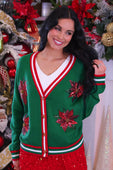 Green christmas-themed sequin poinsettia cardigan with red and white trim and sequined poinsettia flowers on front