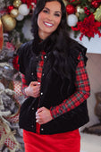 Black velvet quilted vest with silver buttons and velvet finish worn over red and green plaid shirt with ruffle shoulder details