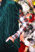 Emerald green velvet quilted vest with diamond stitching and velvet finish featuring ruffle shoulder details