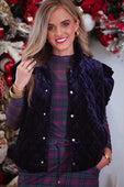 Navy velvet quilted vest with ruffle shoulder details and white button closures featuring a velvet finish