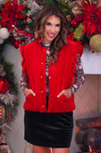Red velvet quilted vest with velvet finish featuring sleeveless design ruffle shoulder details and button closure